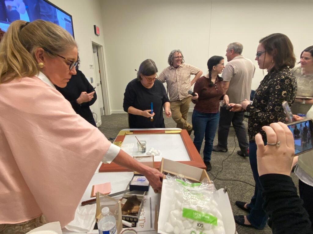 Ginny Newell  and other members at a workshop