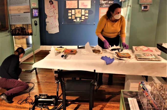 Katie Boodle organizing materials for a hands-on conservation demonstration.